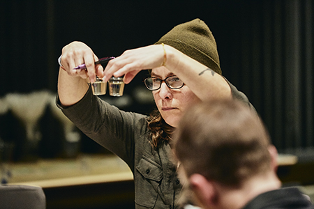 Andrea Stanley compares two wort samples at the 2019 Malt Cup