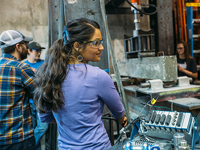 A student works in an engineering lab on campus.