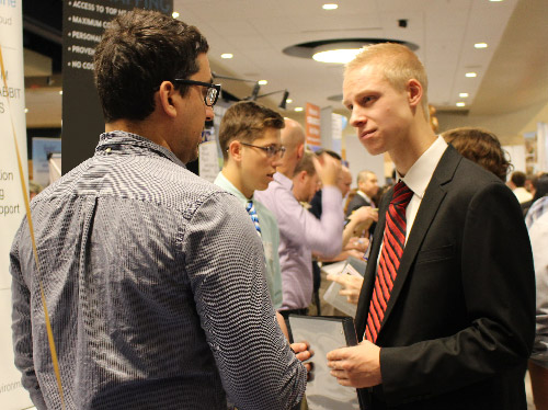 Student speaking with a business recruiter