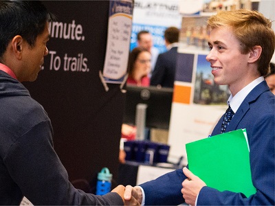 Student shaking hand with recruiter
