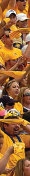 Fans dress in gold for a Gold Rush football game