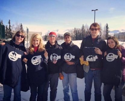 Group of students in Alaska with matching sweatshirts from a volunteer income tax assistance program.