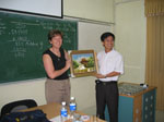 Dr. Wisner receives framed Pagoda from a Vietnamese student