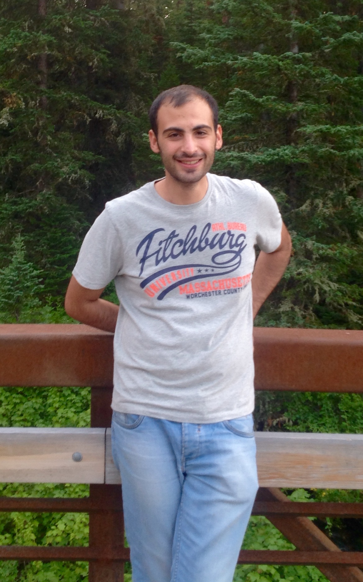 Amir Jafari standing if front of a forest