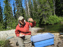 student on river