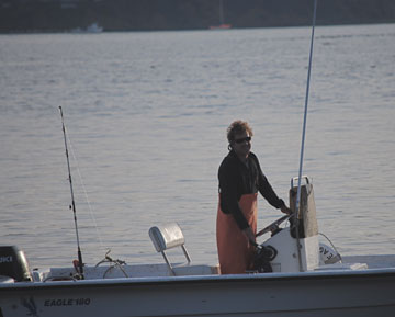Paul in a boat on a lake
