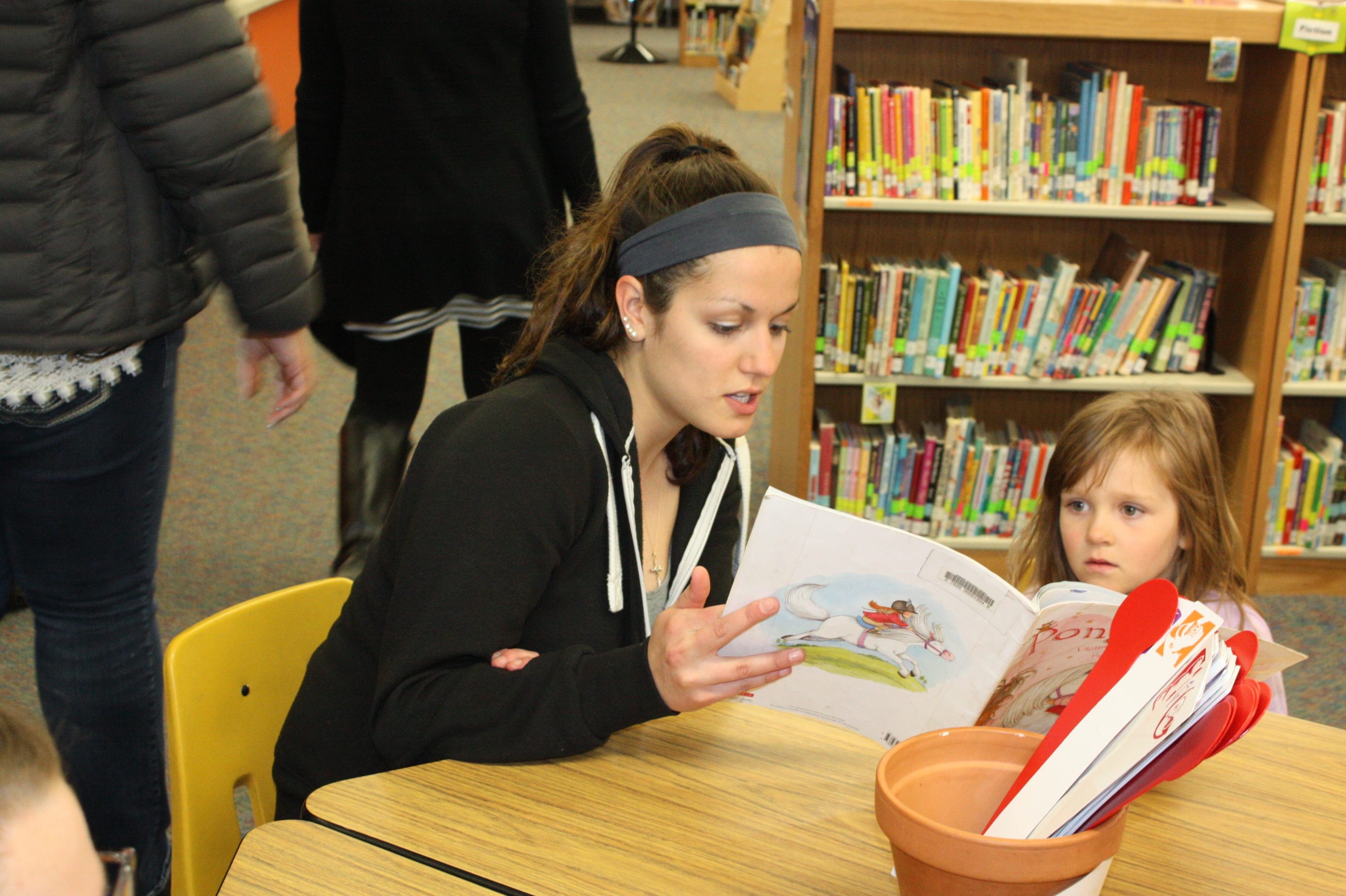 EHHD student reads with elementary student at Heck Quaw Elementary in Belgrade, Montana