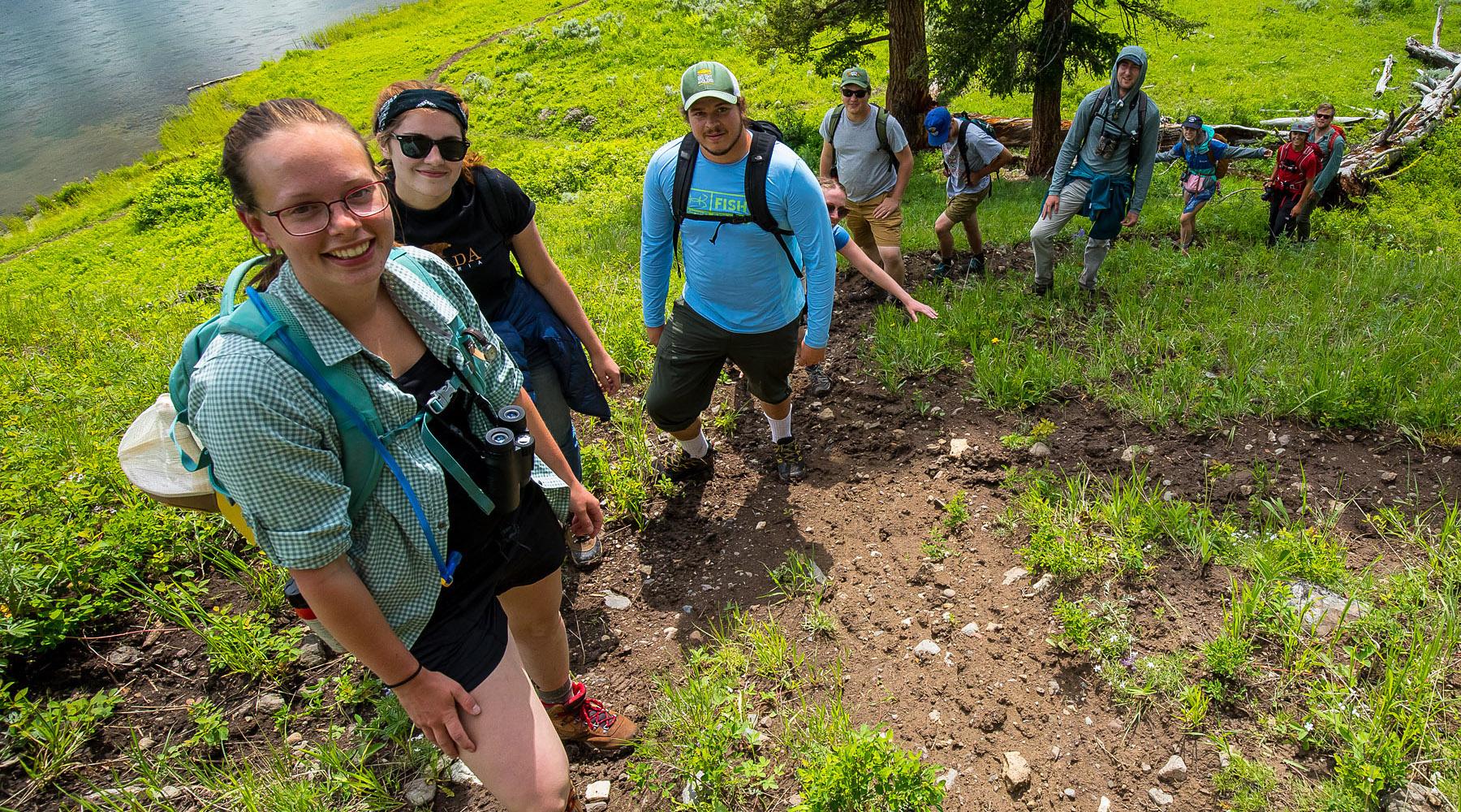 A class of students poses for a picture during a field class