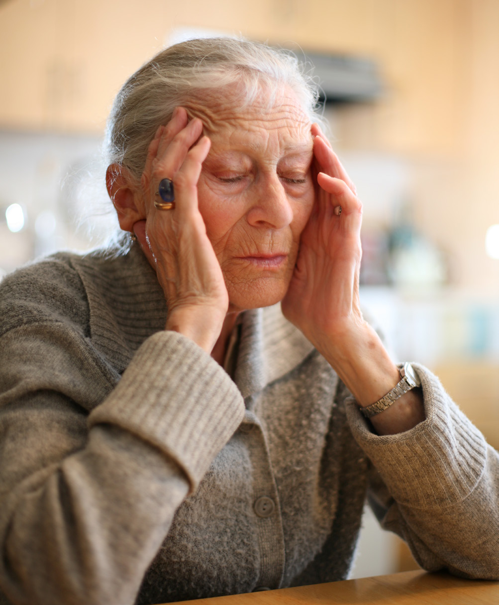 Elderly Women with Hands on her Head