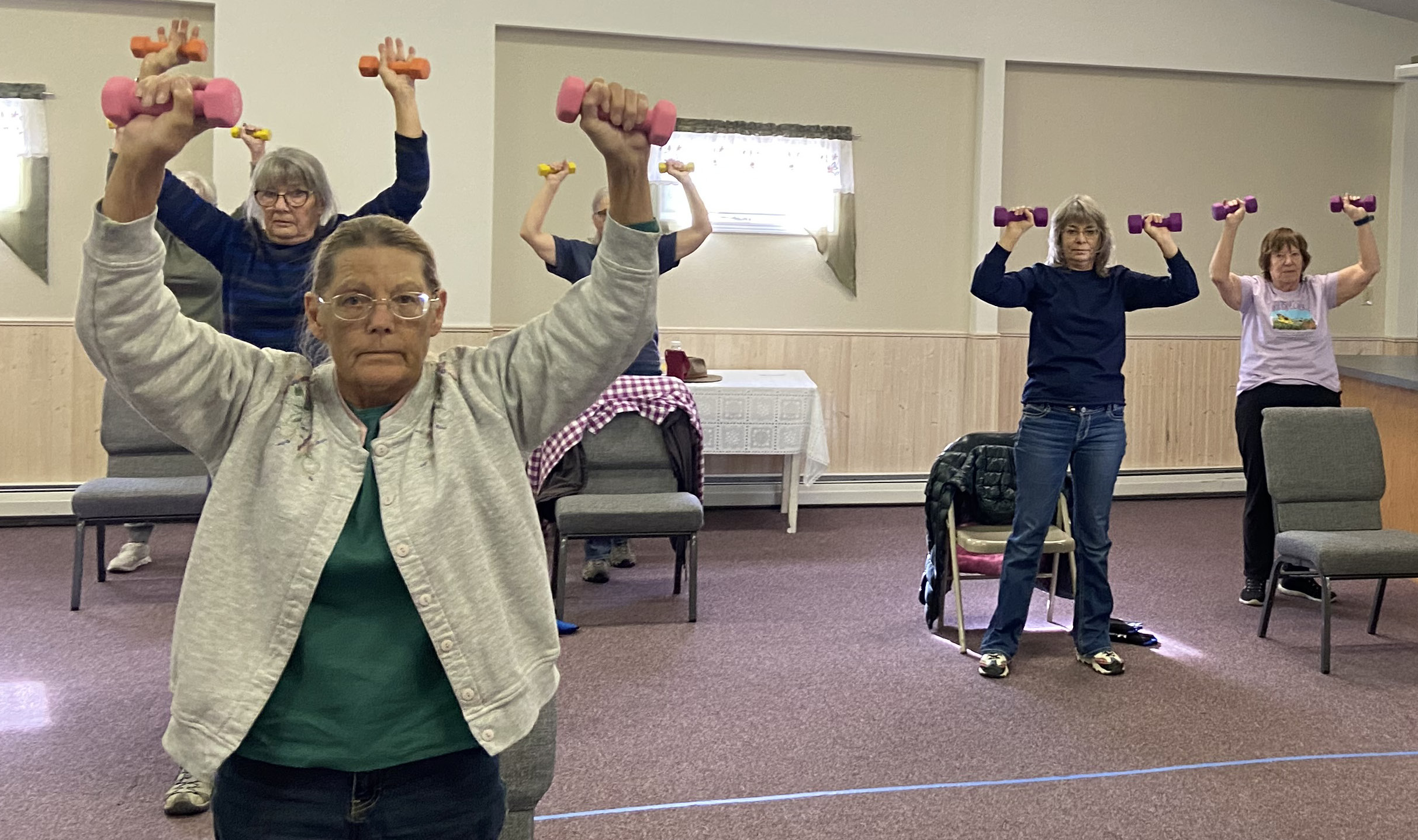Elderly Women Exercising with Dumbbells