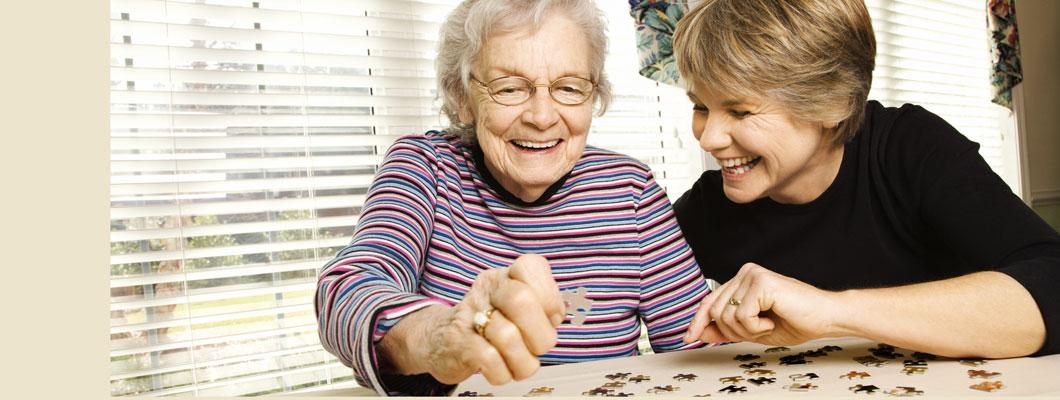 women doing puzzle