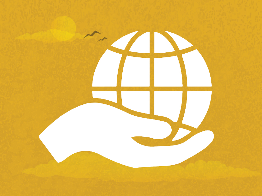Image of a hand palming a globe on a golden sky background.