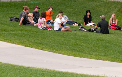 students meeting on the lawn