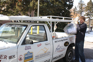 Aaron Watson and Sparky pick up recycling on MSU campus.