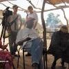 016 - Back: Eric Chaikin and Josette Woodenlegs discuss plans for the day.
Keriba Coulibaly, IER Plant Scientist and Interpreter for the Americans (white shirt)
chats with the Chief of the Village of Sanambele (right front)