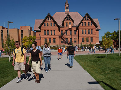 Students walking near Montana Hall on campus