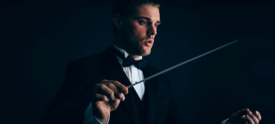 Studio portrait of Andrew Major conducting music