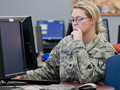 Student veteran working at a computer
