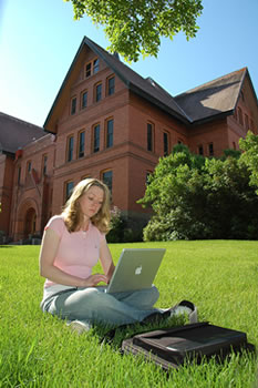 Student studying in front of Montana Hall
