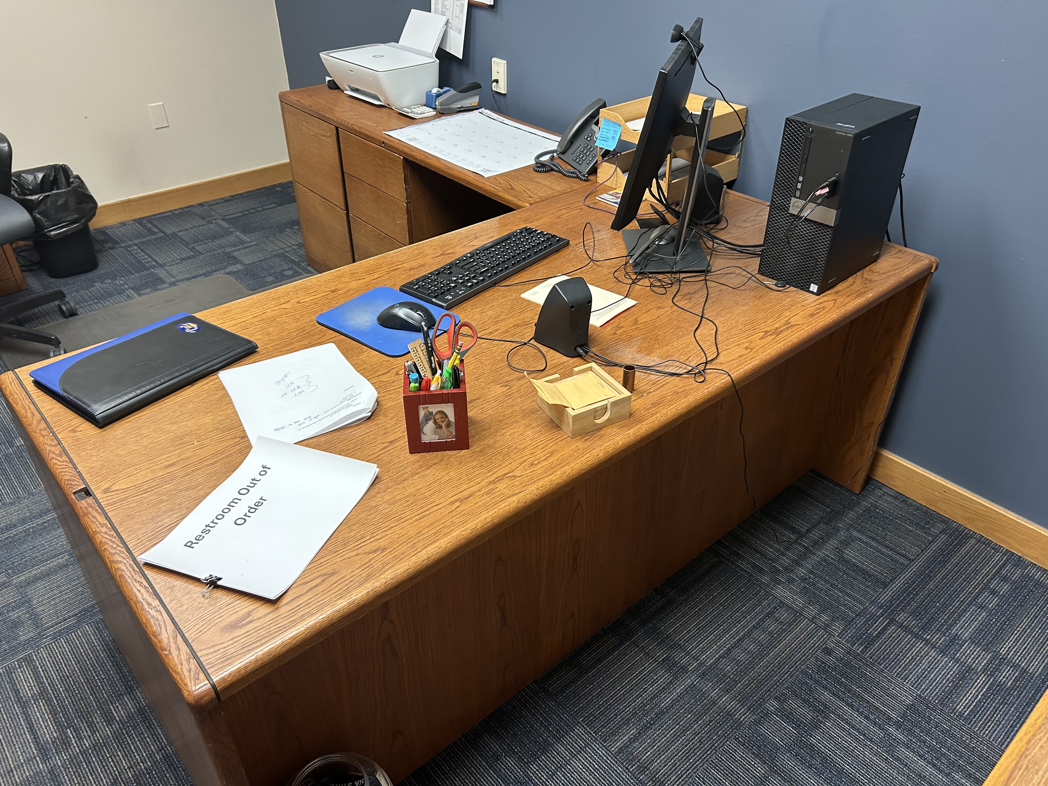 Wooden L-shaped desk front view