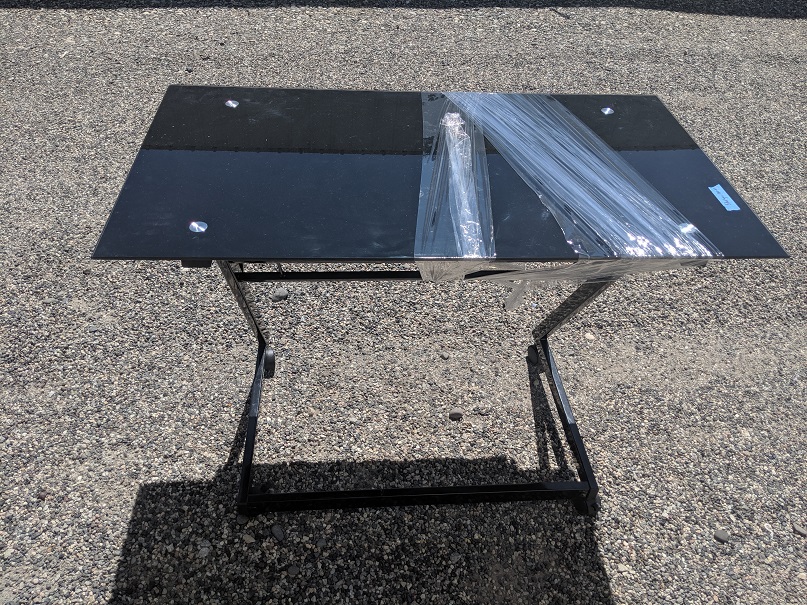 small black glass desk with wheels