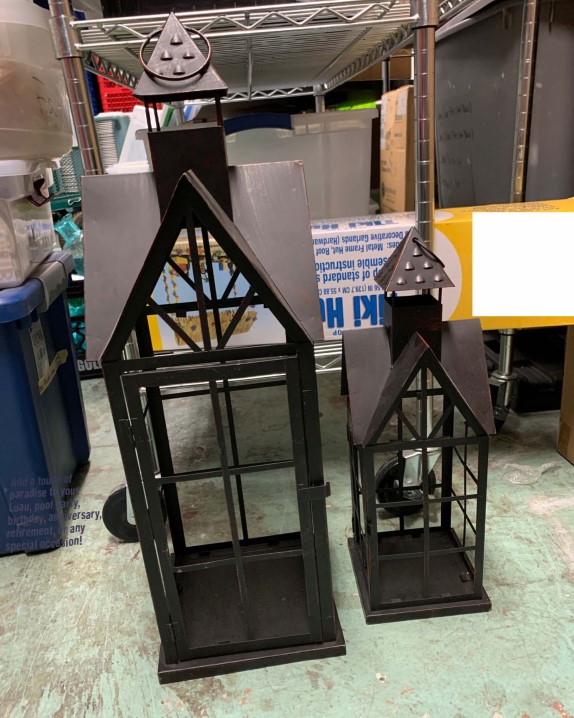 two decorative metal house shaped lantern centerpieces