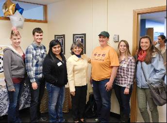 Six students standing with President Waded Cruzado in the TRiO Offices