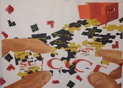 Poster of with an image of puzzle pieces spilled out of a box labeled "success"