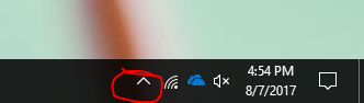task bar showing white up arrow.
