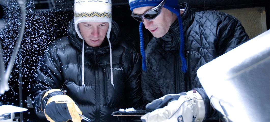 Two students work in a subzero science lab.