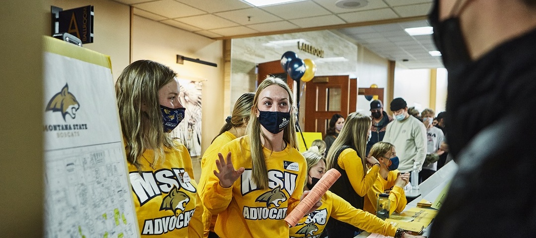 An Advocat helps an MSU Friday attendee