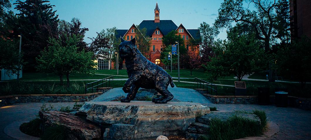 Statue of Spirit the Bobcat at twilight