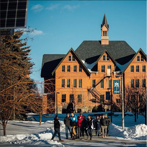 Campus tour in front of Montana Hall in winter.