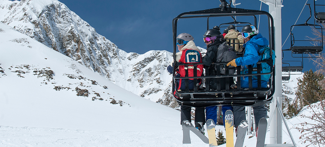 A group of students ride a chairlift at nearby Big Sky Resort.