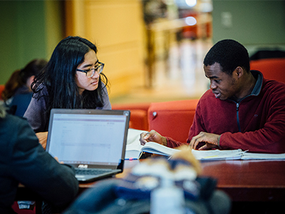 Students work on campus in a group.