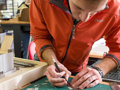 A student works on a model.