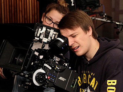 A student works with a camera.