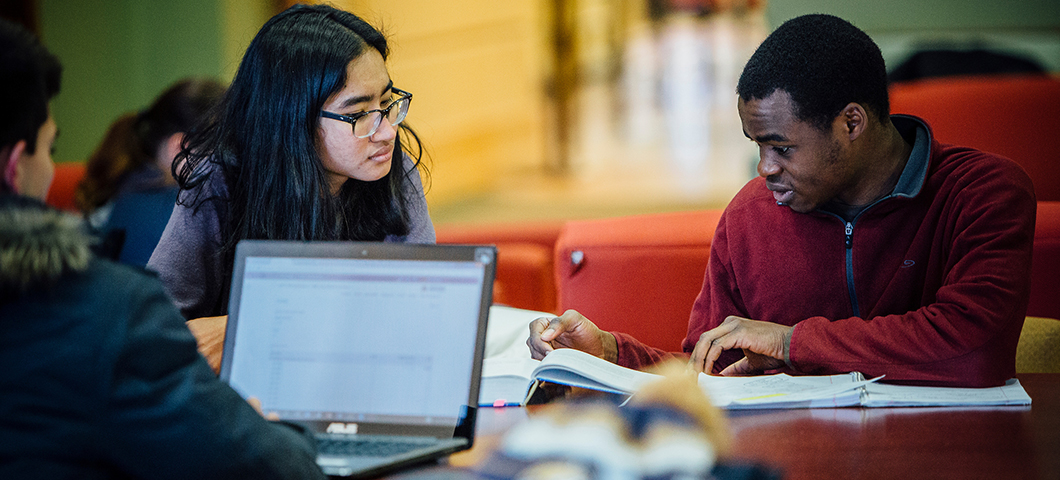 A group of students studying around a table.