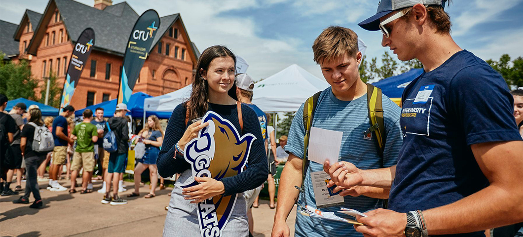 Group of students on the campus mall during the information fair.