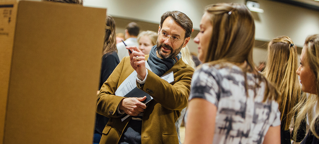 Faculty member talking to a student