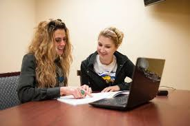 two women studying together