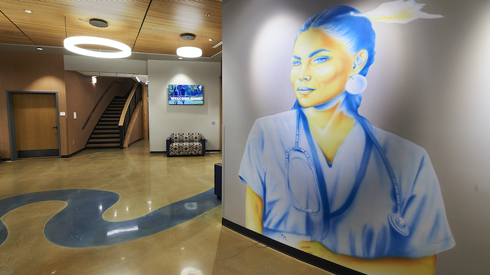 A mural by Wyoming artist Robert Martinez, Northern Arapaho, depicts a Native nurse in this colorful rendering inside MSU’s American Indian Hall.