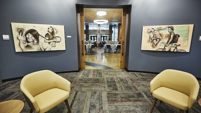 American Indian Hall’s Great Hall is framed by the doors of the building’s student commons. The commons provide a space for students to study, collaborate, and build community.