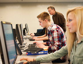 Bozeman High School senior Lillie Hawkins and junior Hugh Jackovich use the computer coding language Python to program a graphic based on the game “Minecraft.”