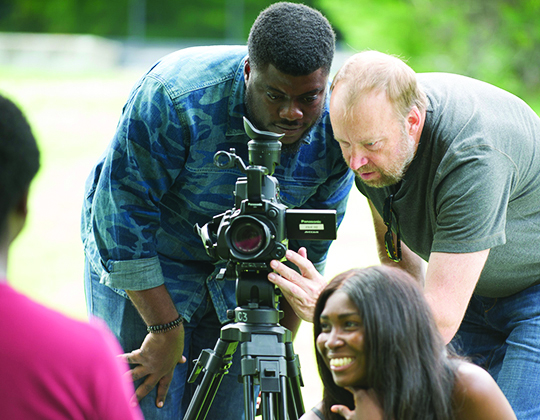 Theo Lipfert, film professor, works with Nigerian filmmakers while they learn documentary filmmaking as part of a month-long, Ford Foundation-funded workshop at MSU.