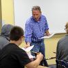 Professor Peter Tillack is helping students in class.