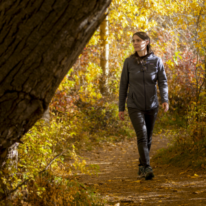 Amanda Hohner walking through a forest.