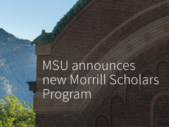 An academic building and trees are seen in the foreground, with a mountain range in the background. A decorative white "M" is seen on the mountainside.  | MSU