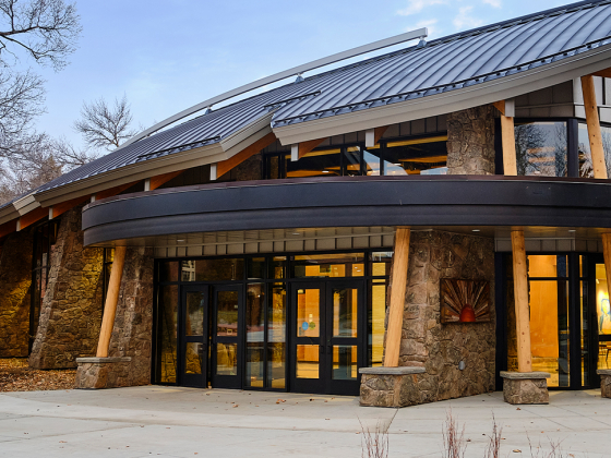 main entrance of American Indian Hall, it is graced with a roof resembling a feather