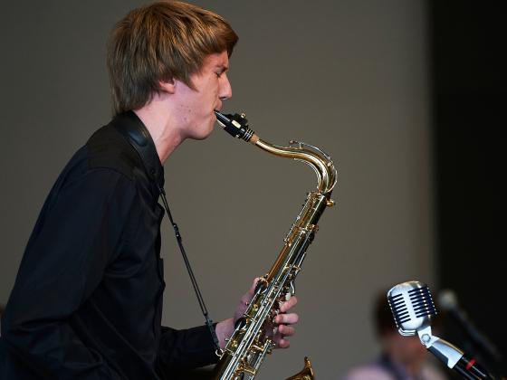 Photo of a person playing a saxophone | MSU photo by Kelly Gorham